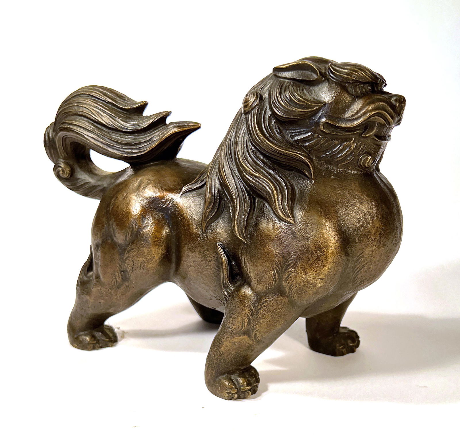 Chinese Bronze Guardian Foo Lion: Chinese Bronze Guardian Foo Lion, signed on the belly. Original patina. 6 3/4" t x 8 1/2" w x 4" d.