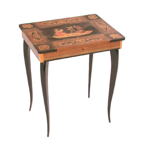 Inlaid Musical Table: TABLE. Inlaid musical table having inlaid lift top (music plays) and sides, the top centered with a figural composition of peasants dancing, on tapering ebony legs, in working order, 20 1/2"h x 17 1/2