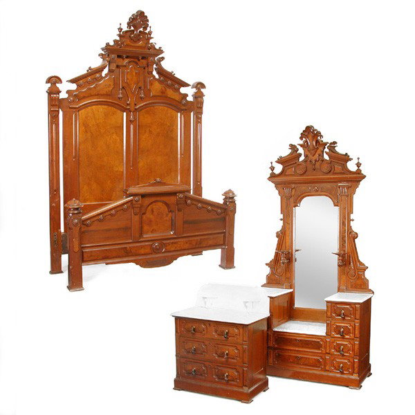 American Victorian Renaissance Revival Bedroom Set: BEDROOM SET. American Victorian Renaissance Revival bedroom suite consisting of a marble top drop center dresser, a commode, and a bed of similar carving, the bed and dresser with carved crowns and tu