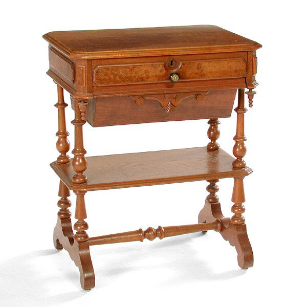 Victorian American Walnut Sewing Table: TABLE. American Victorian walnut sewing table having two drawers including a yarn compartment, a shelf below, the whole rising on spool turned legs, 29 1/2"h x 2"w x 17"d. In very good condition.