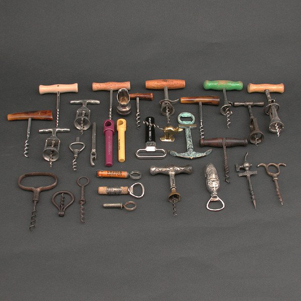 Cork Screw Collection: CORK SCREWS. Cork screw collection including 29 corkscrews in a myriad of shapes and designs, including resin, painted wood, and metal handles, with one wolf form cast metal bottle opener. In good con