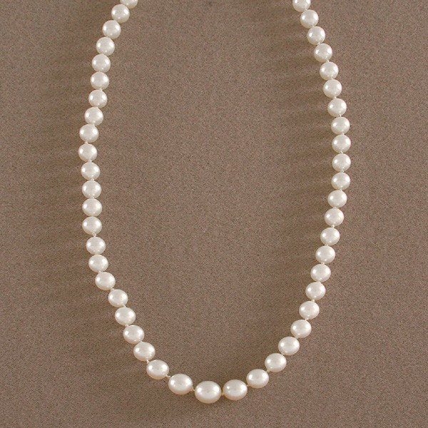 Mikimoto Pearl Strand: NECKLACE. Graduated strand of Mikimoto pearls, appx. 6 - 9mm. 18" in length.