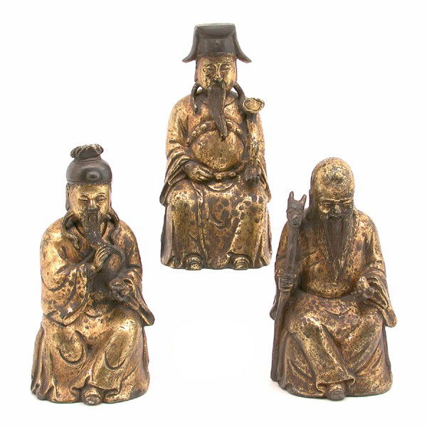 Trio of Gilt Bronze Fu Lu Shou Figures: FIGURES. Trio of gilt bronze Fu Lu Shou figures, depicted seated and bearing ruyi staff, ingot, and like objects, the tallest 8 1/4"h. In good condition, typical oxidation.