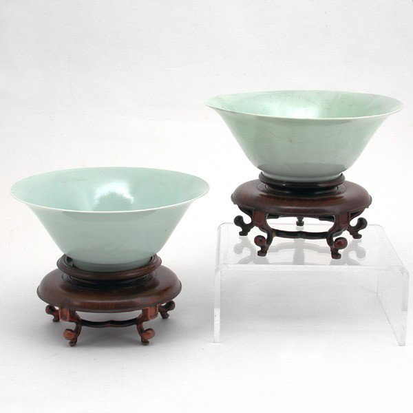 Pair of Qing Pale Celadon An Hua Ming Style Bowls: BOWLS. Pair of Qing era pale celadon porcelain bowls modeled after a Ming style, with everted rim, with apocryphal Ming seal to bases, 'Da Ming Wan Li Nian Zhi', with an hua decoration, on finely carv