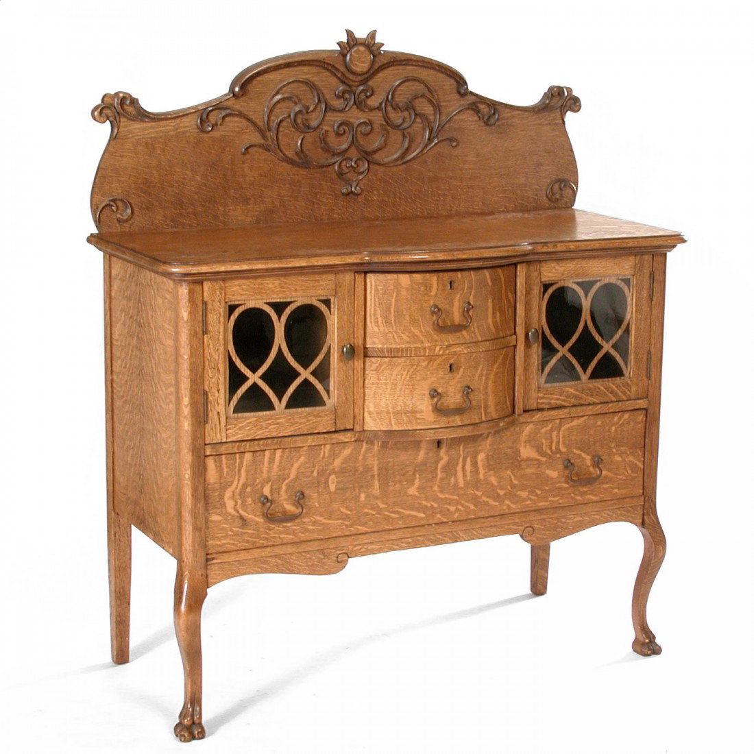 American Oak Sideboard/ Buffet: SIDEBOARD/BUFFET. American Oak Sideboard/Buffet, the shaped and carved backsplash above glazed door cabinets and bowed front on shaped claw footed legs, 56"h x 48"w x 24"t, very good refinished condit