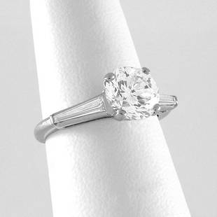 Platinum 2.20 Carat Diamond Ring with Baguettes: RING. Platinum setting with two tapered baguettes featuring one 2.20 carat round brilliant diamond, appx. F-G color and VS1-VS2 clarity, size 7 3/4.