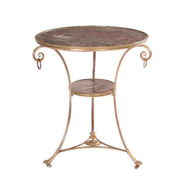 Neoclassical Marble and Gilt Metal Gueridon: TABLE. Neoclassical marble and gilt metal gueridon having circular modeled marble top over intermediate shelf, raised on shaped tripod legs, joined by triangular metal stretcher, 19th century, 27"T by