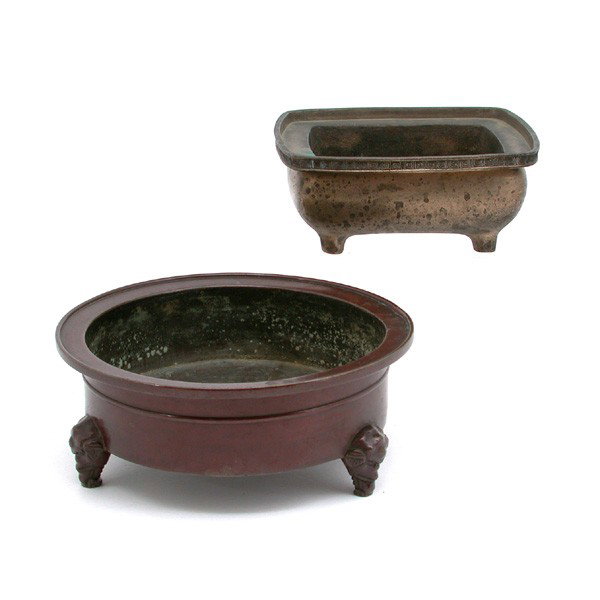 2 Japanese Bronze Censors, 3 leg & 4 Leg: CENSORS. 2 Japanese Bronze Censors, 3 leg with brown patina, elephant mask legs and dragon on bottom, 3"h x 7"d and the 4 leg with engraved rim and signature mark on bottom, 2 1/2"h x 6" square.