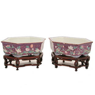 Pair Chinese Aubergine Jardiniere, Qing Mark: JARDINIERE. Pair Chinese Aubergine Jardiniere, Qing Mark, flower decorated on raised geometric feet and fitted wood stand. Porcelain 3"h x 9"w x 6 1/4"d,, on stands 5 1/4" tall, very good condition.