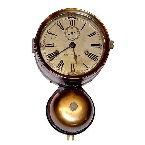 Seth Thomas ship's clock with bell under: CLOCK. Seth Thomas ship's clock with bell under. This clock is nickel plated brass and is in very good condition overall. Most paper label on back is intact. Clock is running and strikes the proper sh