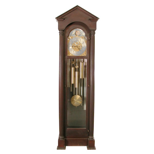 Herschede Tall Clock in the Gothic Style: TALL CLOCK. Herschede tall clock with pediment and Corinthian column case, fancy brass dial with moonphase calendar and second bit. Nine tube, Westminster and Whittington chimes. 97" h, Retains origin