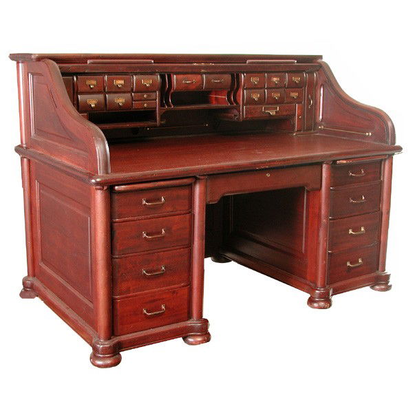 Mahogany Rolltop Desk, Leopold Desk Co. #666: DESK. Mahogany rolltop desk made by the Leopold Desk Co. numbered 666. This substantial mahogany roll top desk with raised panels, fancy roll, complete full drawer interior above column corner pedesta