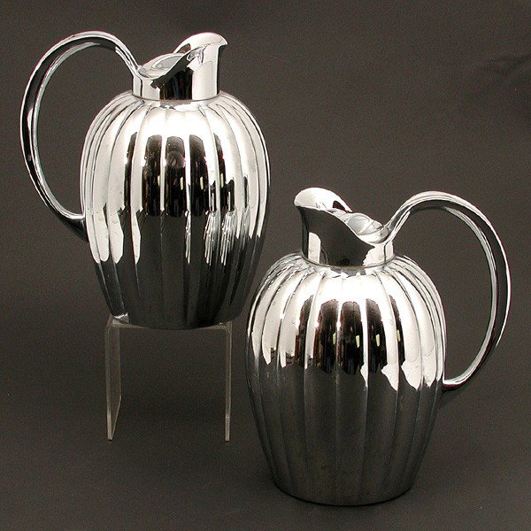 Two (2) Georg Jensen Thermos': THERMOS'. Pair of Georg Jensen Danish thermos' with fluted detail. 9.25" h, in very good condition.