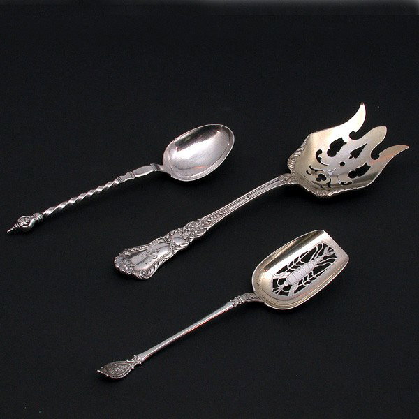 Three (3) Silver Serving Utensils: SERVING UTENSILS. Lot of three silver serving utensils, to include: 1 (10.25" l) Gorham sterling silver serving fork with monogrammed top, foliate motif on handle and through carved bowl; 1 (8") Frenc
