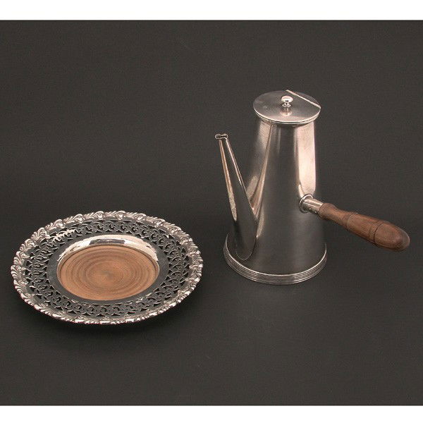 Tiffany & Co. Coffee Pot and Sterling Wine Coaster: LOT. Tiffany & Co. coffee pot with wooden handle, 2 pint, and sterling wine coaster with wooden insert. Pot is 8" h, coaster has 7.75" diameter, in very good condition.