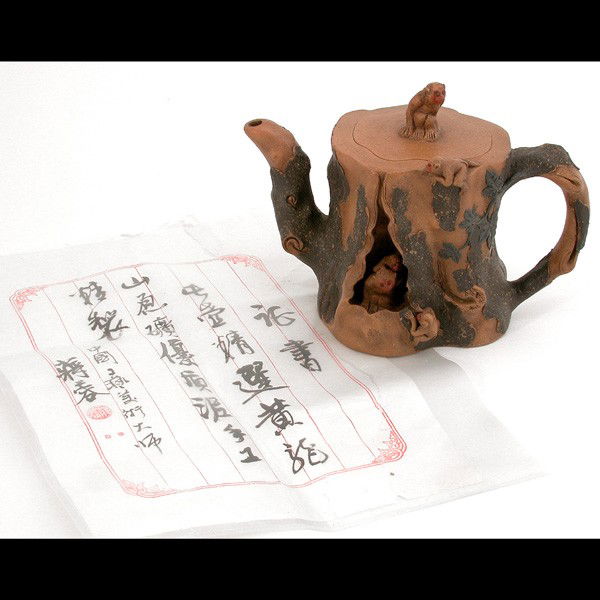 Yixin Zisha Teapot, Jiang Rong: TEAPOT. Yixin Zisha teapot, Jiang Rong with certificate of the potter, signed Jiang Rong, 5.2" h.