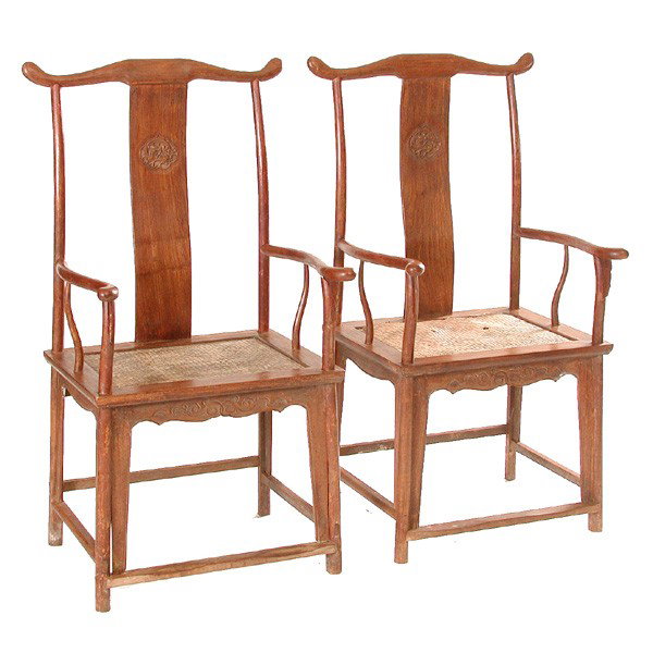 Pair of Chinese Arm Chairs, Probably Huanghuali: ARM CHAIRS. Pair of Chinese arm chairs, probably huanghuali, with carved back splats and rattan seats. 47" h x 24" w x 20" d.