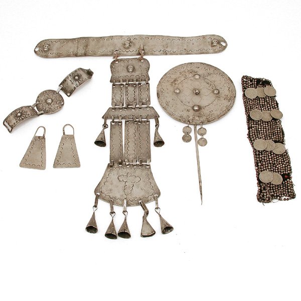 Chilean Silver Costume Accessories: SILVER. Chilean silver costume accessories, 6 pieces, stamped with skulls and geometric design. Largest piece measures 16" l.