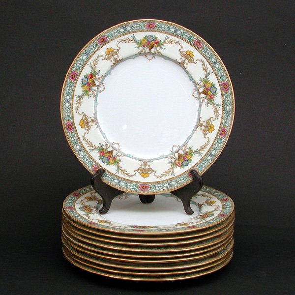 10 Mintons Dinner Plates: CHINA. Lot of 10 Mintons dinner plates with floral garland and vase motif on rim, marked and numbered "REG NO 702578" on bottom. 10.125" diameter, no apparent chips or cracks, in nearly unused conditi
