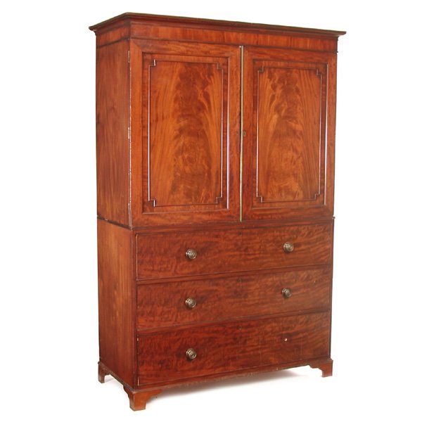 English Mahogany Linen Press, 19th century: PRESS. Early 19th century English mahogany linen press. The upper cabinet with figured mahogany paneled doors above a three drawer base on bracket feet. 85.5" h x 53" w x 24" d, in good condition, mis