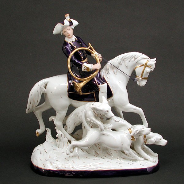 Royal Dux Porcelain Group: ROYAL DUX. Royal Dux porcelain group with horse rider and hounds. 19.5" h x 16.5" w x 9" d, in very good condition with no apparent damage or repairs.