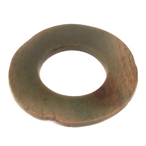 Chinese Jade Pi, Han Dynasty: PI. Chinese jade pi, green with brown veins, Han Dynasty. 4.25" diameter. Property of a San Francisco family, purchased in the late 19th/early 20th century.