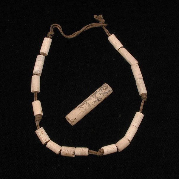 Chinese Jade Necklace, Han Dynasty: NECKLACE. Chinese jade necklace, cylindrical calcified beads, Han Dynasty. 10" l. Property of a San Francisco family, purchased in the late 19th/early 20th century.