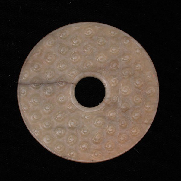 Chinese Jade Pi, Han Dynasty: PI. Chinese jade pi with raised circular pattern and incised design on reverse, Han Dynasty. 2.125" diameter. Property of a San Francisco family, purchased in the late 19th/early 20th century.