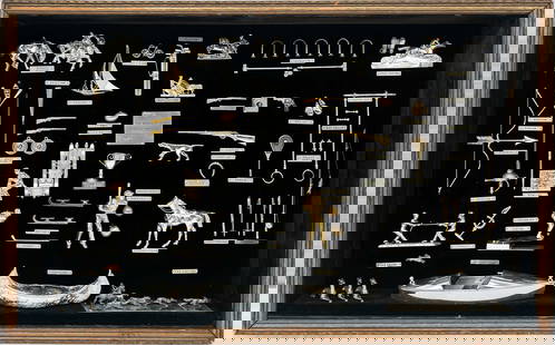 Sport memorabilia diorama in gold and silver dollhouse miniatures: Sport memorabilia diorama featuring the world of sport in gold and silver miniatures. In original wood shadowbox frame with glass front and black velvet background. Features dollhouse miniatures and o
