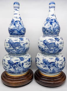 Monumental Chinese Blue and White Triple Gourd Lidded Vases: Monumental Chinese Blue and White Triple Gourd Lidded Vases. With foo dog, cloud and wave motifs. Marked on bottom with Qing Yongzheng mark. 20th century. The vases are oversized on fitted hardwood st