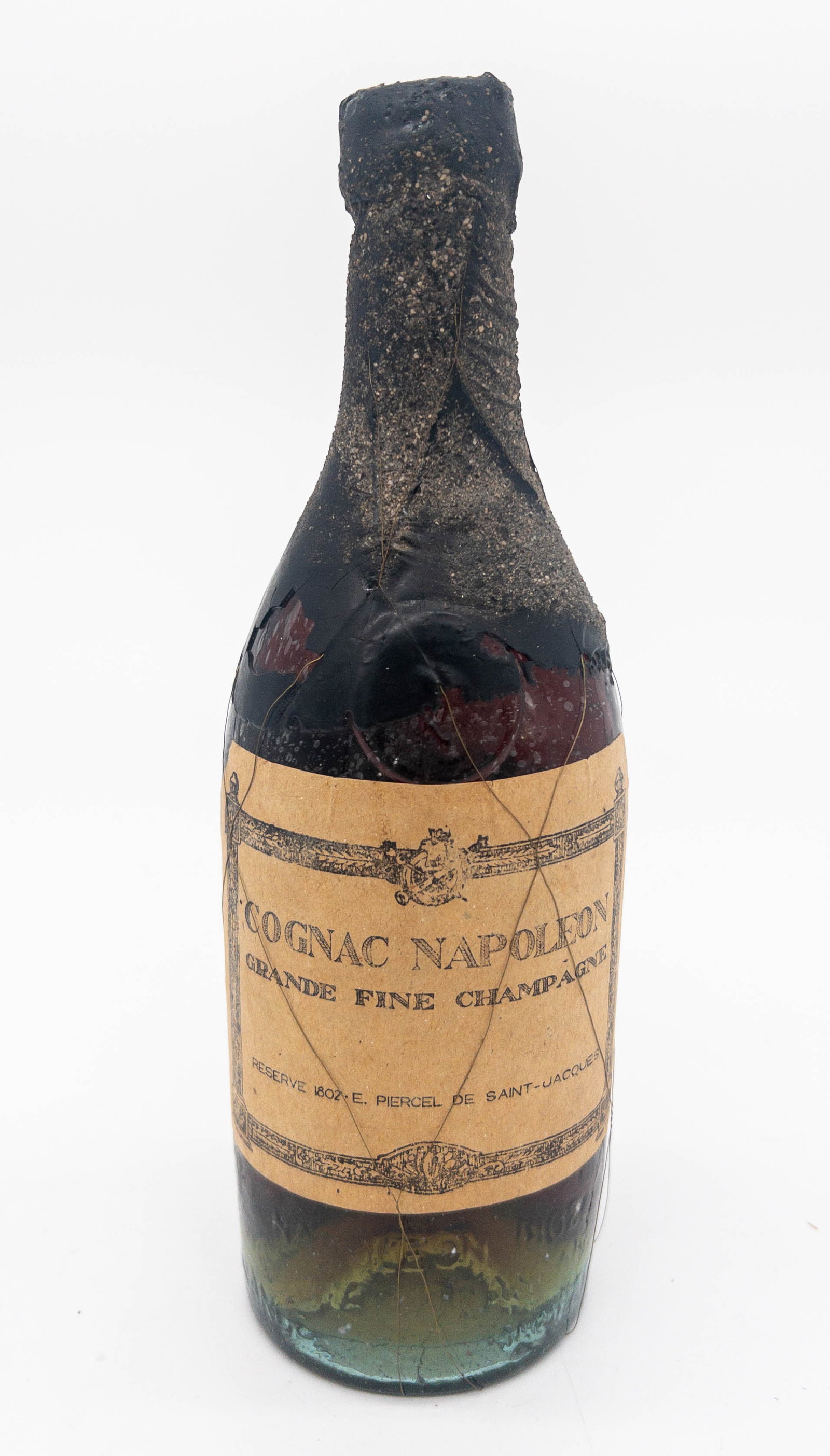 1802 Napoleon Grande Fine Champagne: 1802 Unopened Napoleon Grande Fine Champagne from Cognac, France. Fine condition with multiple labels and wire "harness" mostly intact. Bottle measures:10" tall