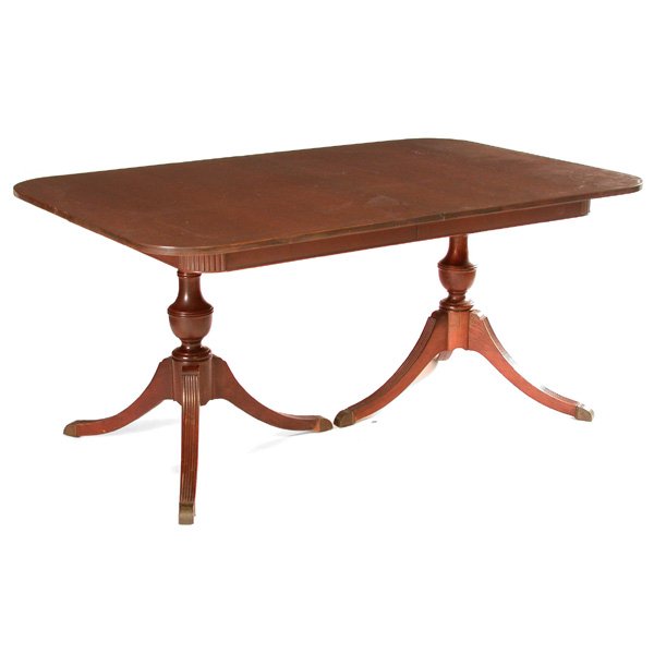 Duncan Phyfe Style Mahogany Dining Table: TABLE. Duncan Phyfe style mahogany dining table with rounded corners, two tripod leg pedestals and three 12" leaves. Closed: 30" h x 64" w x 42" d, in very good condition.