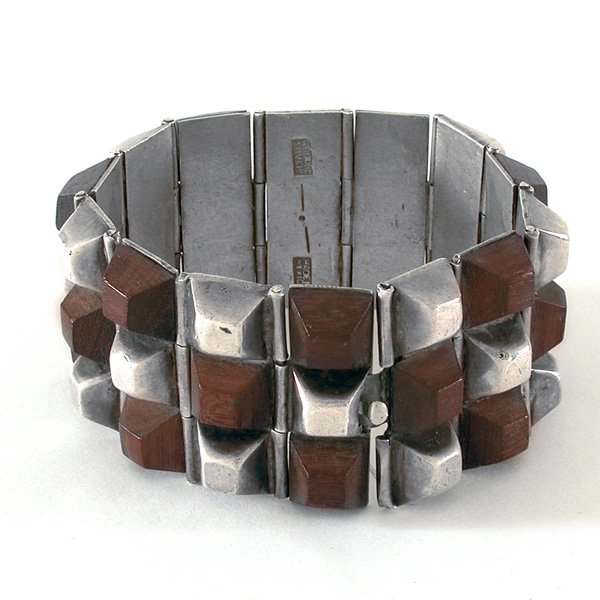 Spratling Silver & Exotic Wood Link Bracelet: BRACELET. William Spratling silver and exotic wood bracelet composed of rosewood and silver pyramidal flexible links, circa 1931-1946, hallmarked "Spratling Silver" "Made in Mexico", 1 1/2" wide, 7" l