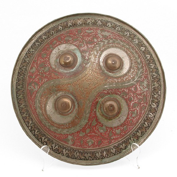 Indo Persian Shield: SHIELD. Indo Persian circular shield with intricate enamelwork and carving. 14.75" diameter, in good condition with some old repairs.