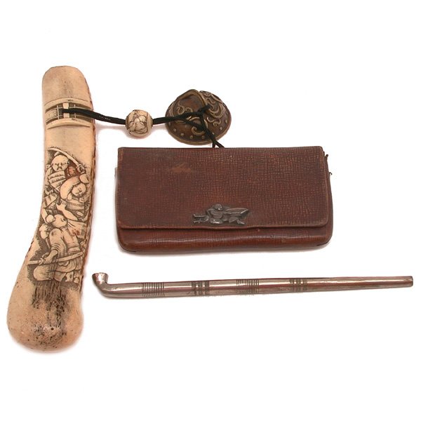 Japanese Kiseru Case and Tobacco Pouch: LOT. Japanese carved stag horn kiseru case and a Japanese tobacco pouch with figural clasp. Largest measures 9" h, both in good condition.
