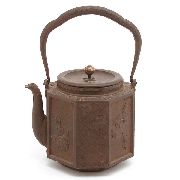 Japanese Bronze Teapot, signed "Unryudo": TEAPOT. Japanese bronze hexagonal teapot with scenic medallions, signed "Unryudo" under lid. 10.75" h with handle, in very good condition.