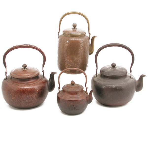 4 Japanese Copper Teapots: TEAPOTS. Lot of 4 Japanese copper teapots, to include: one with bird motif and calligraphy, 10.5" h with handle; one with incised floral design, 10" h with handle; one with embossed crabs, 9" h with h