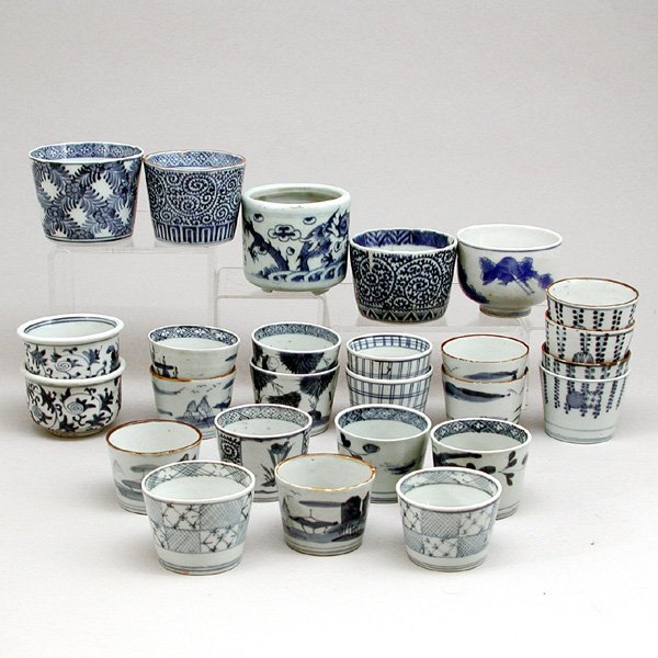 Lot of Japanese Blue & White Soba Cups, 26 count: PORCELAIN. Lot of 26 Japanese blue & white soba cups, Edo period. Largest measures 4" diameter, in good condition, 3 with minor chips to edge and one with minor crack.