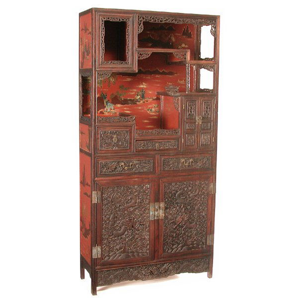 Chinese Hardwood and Lacquer Cabinet, Republic: CABINET. Hardwood (probably huanghuali) and lacquer cabinet, Republic period, with staggered openshelves over a pair of drawers and double doors carved in high relief with dragons in a bed of cloud sc