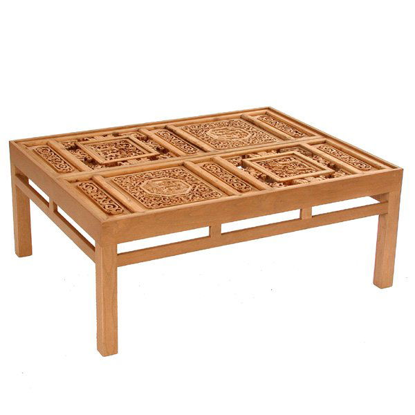 Chinese Panel Coffee Table: TABLE. Chinese carved wooden panels mounted into a contemporary table, under glass, 16"h x 40"w x 31"d, very good condition.