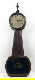 American Banjo Clock With Mahogany Case: American Banjo Clock, indistinctly signed on dial, with single weight in mahogany case. Appx 34" tall to top of finial x 11" at widest x 3 3/4" deep. Appears to be running at time of photography.
