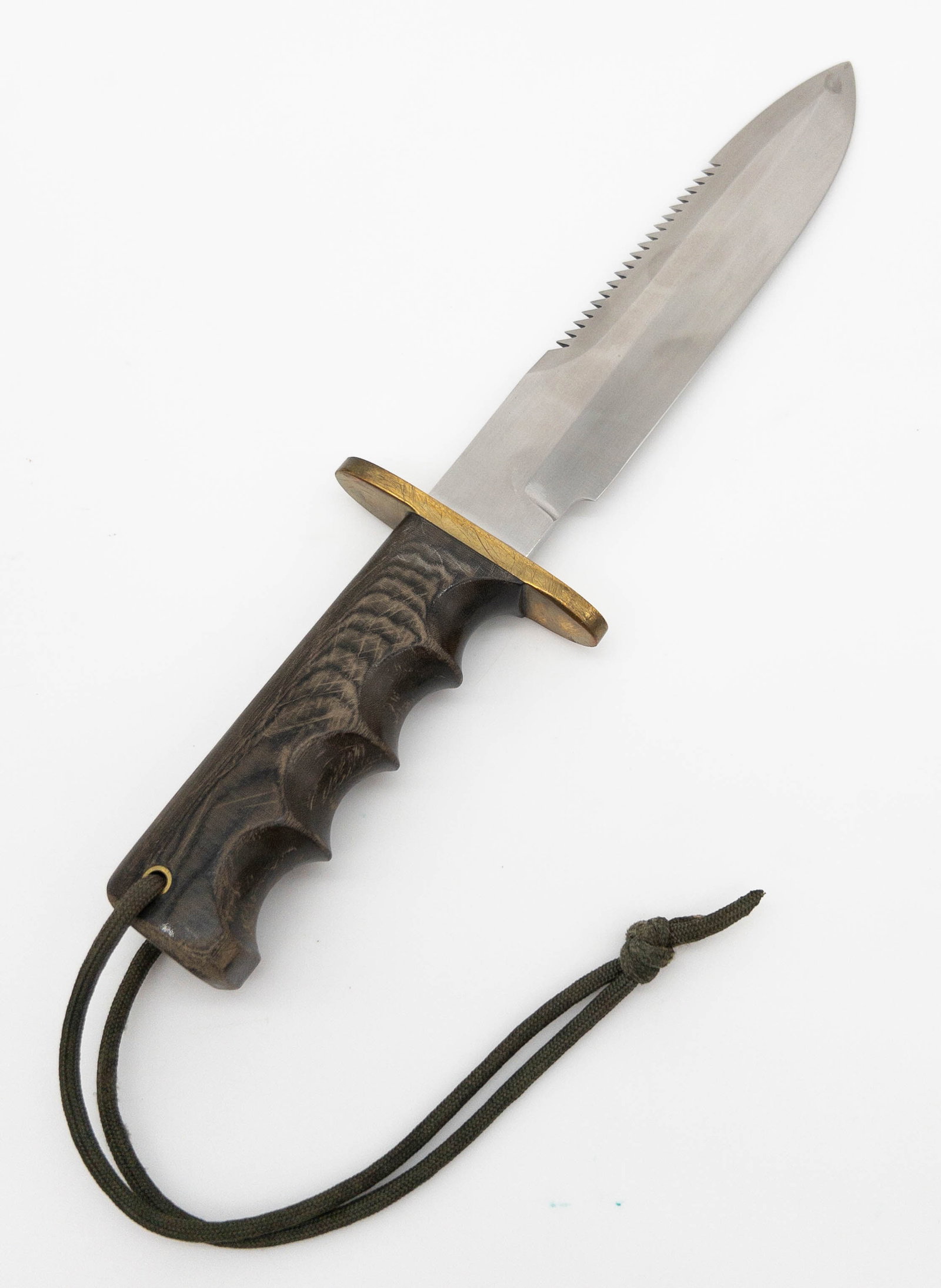 Randall Made Attack Knife: Randall Made Attack Knife. Knife features stainless steel saw tooth blade, straight oblong brass hilt, and full tang wood handle with finger grooves and lanyard. Blade measures appx 7 1/2" long, overa