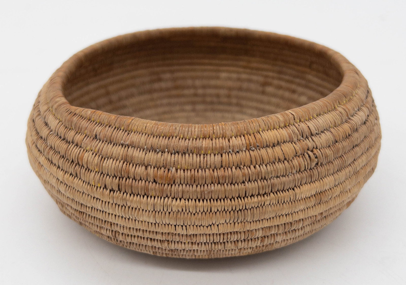 Ultra Fine Native American Panamint Coil Basket: Ultra Fine Native American Panamint Coil Basket. Appx. 2 1/4"tall x 5 1/2" widest point. Sun faded design.