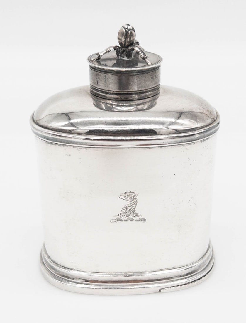 1748 London Sterling Silver Tea Caddy: 1748 London Sterling Silver Tea Caddy. With floral top and removable base that slides out. With mythological beast at center. Measures appx 4 3/4" tall x 3 1/2" wide. Weighs appx 8.29 troy ounces.