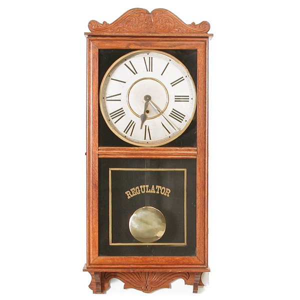 Gilbert Clock Company Wall Clock: American oak cased regulator wall clock with griffin crest and bracket base by the William L. Gilbert Clock Company, Winsted, CT., 36" h x 15.5" w x 4.75" d, very good refinished condition, running.