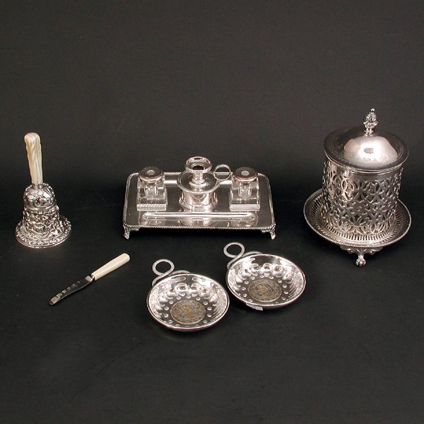 Lot of Silverplate Table Items: Lot of Silverplate Table Items including; English inkwell set, a pair of porringers, Florentine style bell with bone handle, Granton 2 " blade and a Daniel & Arter lidded jar, good condition.