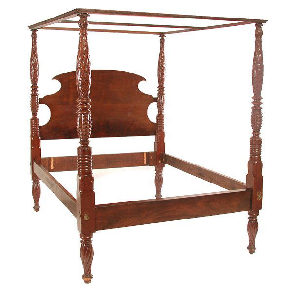 American Mahogany Bed: American Mahogany Bed, the four poster canopy bed with carved headboard, and four posts featuring acanthus, pineapple and turned carving, 80"h x 63"w x 81"d, good condition.
