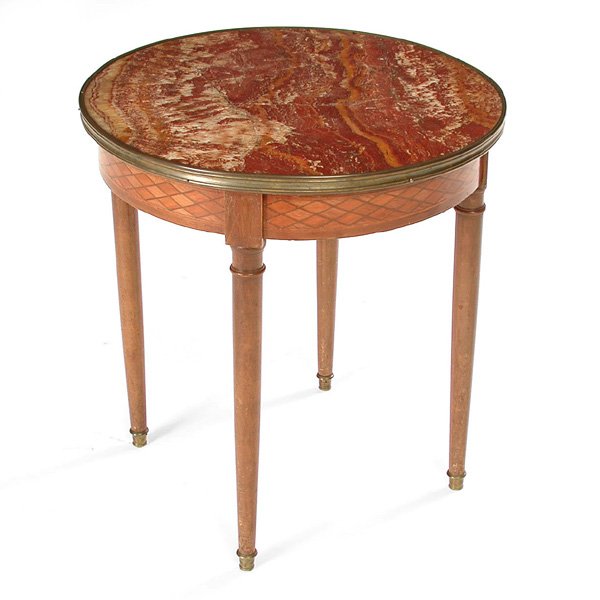 French Occasional Table, 19th c: Round Occasional Table 19th c, French, rouge marble top(cracked) with brass support over a parquetry frieze, on cylindrical legs with brass feet, 18"h x 18 ¾"d, good condition.