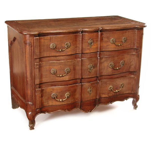 French Provencial Commode, 18th c: French Provencial Commode, 18th c, with molded top above a three-sectioned serpentine front with three graduated drawers having acanthus handles and ornamental keyholes in ormolu, shaped paneling at f