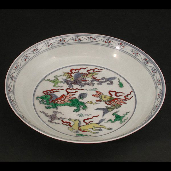 Chinese Doucai Deep Dish, Kangxi period: Chinese Doucai Deep Dish, Kangxi period, Thinly potted with deep well and flared rim, the center painted with mythical beasts, en suite on the exterior, base with mark, 8.9" dia